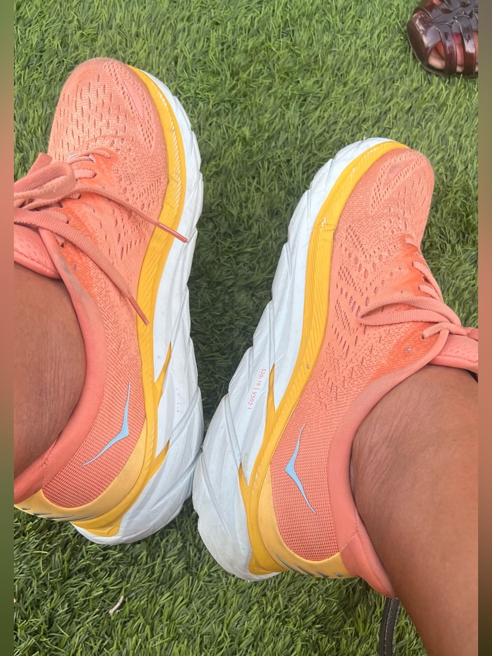 Hoka One One Women’s Coral Peach Running Shoes with Yellow Trim
